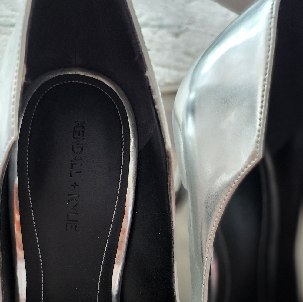 Silver closed toe high heels. About 3.5 inches.